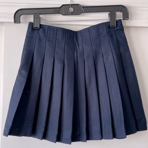 Navy Pleated Skirt with Gold Zipper Detail